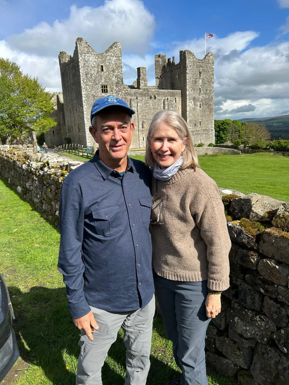 A couple at Bolton Castle in Wensleydale on a comfortable private Yorkshire tour